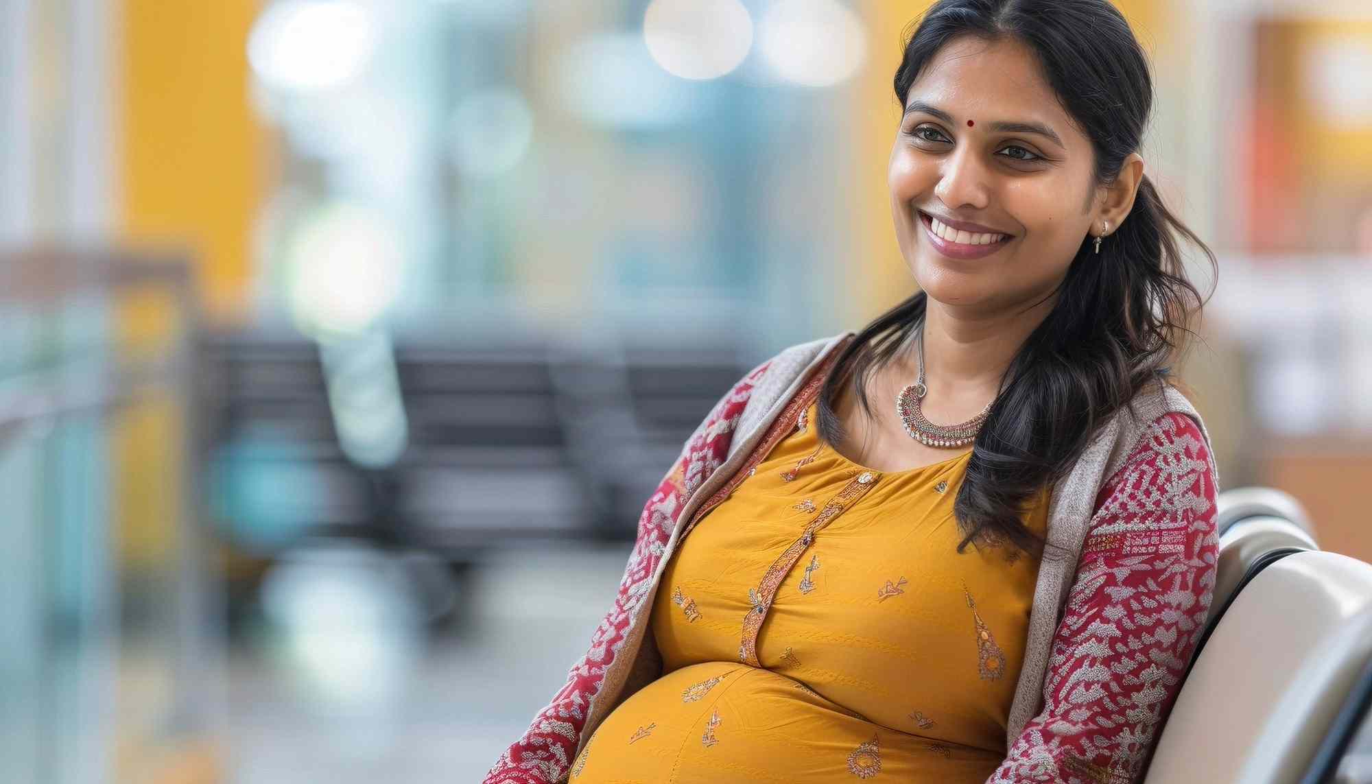 A pregnant woman is smiling as she has visited the the Best gynaecologist in Lake town