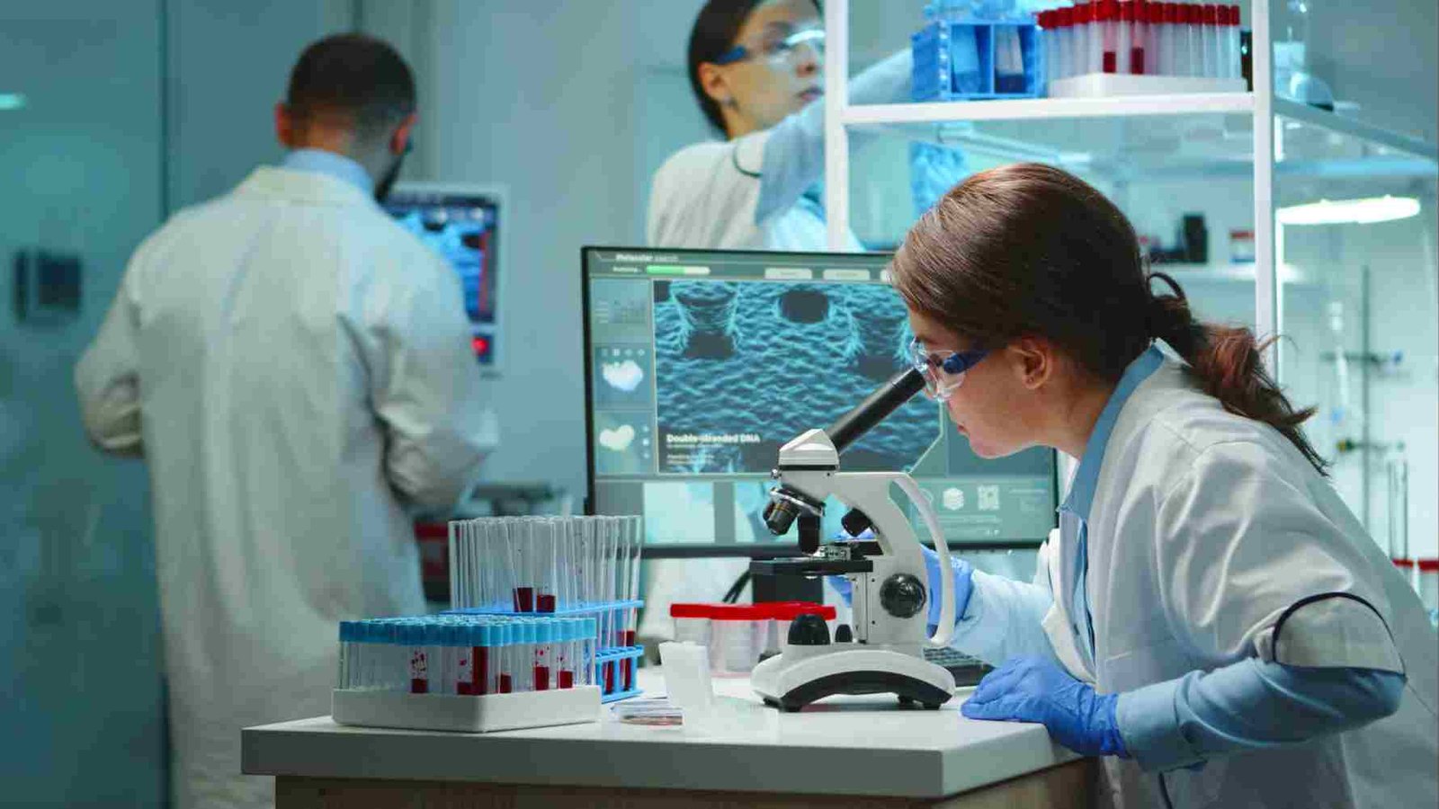 Three doctors are performing lab test at the best diagnostic centre in Lake Town